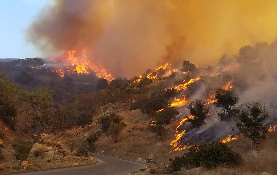 Man Using Measuring Tape in Factory Setting Man Using Measuring Tape in Factory Setting